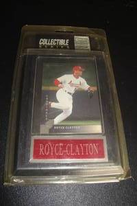 lot 187 image: Donruss Removable St. Louis Cardinals, Royce Clayton Collector Card, in  Plastic Sleeve Mounted on Wall Plaque. Sealed Package