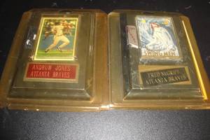 lot 203 image: 2- Removable Collector Cards in Plastic Sleeve Mounted on Wall Plaque, 1- Andrue Jones, Atlanta Braves, 1- Fred McGriff, Atlanta Braves (Needs Name Plate Remounted)