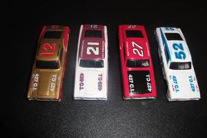 lot 94 image: 4-1992 Racing Champions, 69 Mercury Cyclone Die Cast Race Cars, 1-#12 Bobby Allison, 1-#21 Cale Yarborugh, 1-#27 Donnie Allison, 1-#52 A.J. Foyt 4 X Money