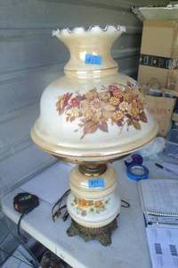 lot 17 image: Vintage Electric Hurricane Lamp, Brown Tones Floral Design, Overall Height About 27, Globe About 12 x 12 Bulb Holder Needs Replaced