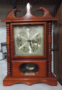 lot 1 image: mantel Clock about 21 inches tall by 12 inches wide