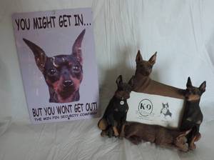 lot 9 image: metal sign and Doberman pitcher frame