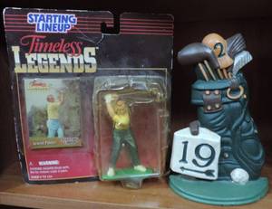 lot 37 image: golf set Arnold Palmer figure  and golf bag & clubs heavy metal stand