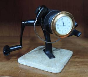 lot 45 image: fishing rode with Quartz clock needs a batter