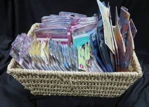 lot 58 image: basket full of new birthday invitations loot bags tablecloths see pic