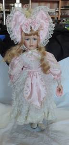 lot 82 image: Porcelain doll approximately 22 inch tall