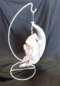 lot 87 image: Hanging porcelain doll wind up and plays music