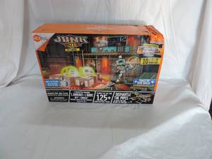 lot 150 image: Junk bots toy new box is got some damage see pictures