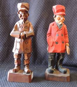 lot 173 image: Hand Carved Wooden Hunter in Red Cap and Coat  and hand carved wood man