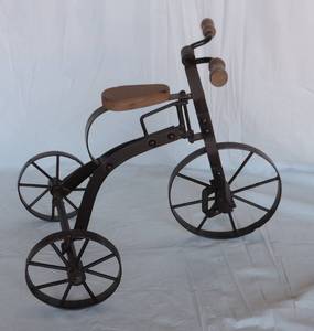 lot 174 image: Small tricycle decor about 9 inchs tall around 12 inchs long