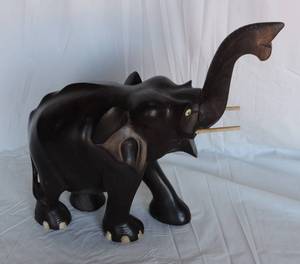 lot 175 image: Hand carved elephant has a little weight to it