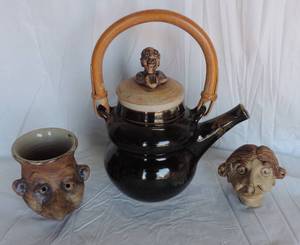 lot 176 image: The woman head is a whistle of some sort  face vase  teapot with handle and lid lid has small chip in it see pictures