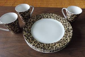 lot 224 image: Leopard pattern plates and coffee cups one plate has a chip in it on the bottom as shown in picture
