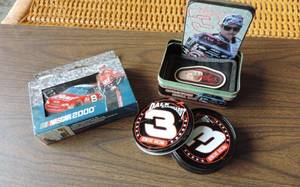 lot 260 image: Dale Earnhardt wallet and tinDale Earnhardt coasters and tin Dale Jr playing cards and tin