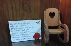 lot 304 image: Save a seat for a loved one sign and rocking chair