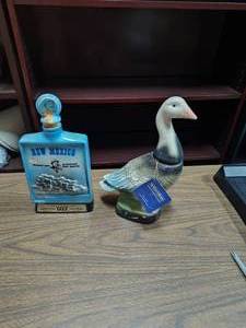 lot 77 image: Two decanters New Mexico and duck check all pic