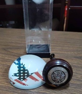 lot 255 image: United States armed forces wine bottle cork and eagle paperweight