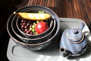 lot 21 image: Blue pottery teapot and matching nesting bowls