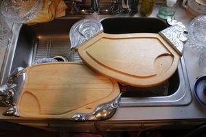 lot 22 image: Pair of cutting boards with pewter accents - one rooster, one pig