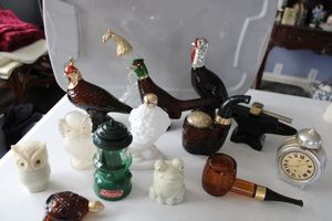 lot 31 image: AVON cologne bottles
