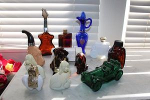 lot 32 image: AVON cologne bottles