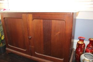 lot 35 image: Marble top dresser PICKUP ON SECOND DAY- 45x19x29. Condition as shown, top does slid off.