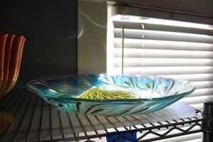 lot 3 image: Colored glass bird bath glass bowl with peacock feather design