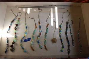 lot 79 image: Beaded ceiling fan and light pulls