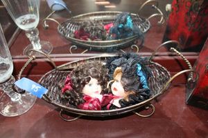 lot 95 image: Wire basket with porcelain doll heads