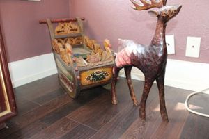 lot 97 image: Wood carved sleigh and reindeer