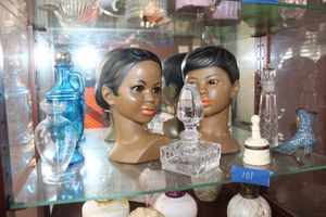 lot 101 image: Household dcor Perfume bottles, Girl and Boy Head Busts as shown