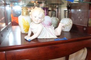 lot 102 image: Child figurine and perfume bottles