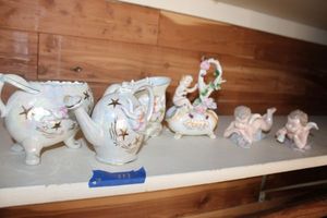 lot 111 image: Opalescent vases, Cherub figurines