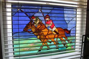 lot 133 image: Stained glass polo players window sun catcher (bring tools to remove)