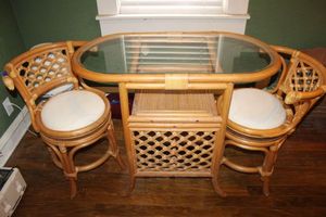 lot 190 image: Bamboo and cane oval glass top table with matching chairs