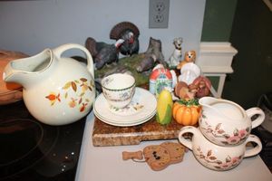 lot 201 image: Vintage tea serving dishes, salt and pepper shakers, turkey figurine, and marble cutting board