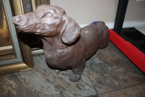 lot 253 image: Heavy cement Dachshund dog statue as shown