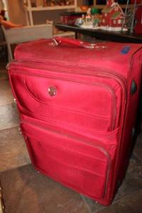 lot 298 image: Red rolling suitcase