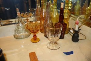 lot 445 image: Yellow and amber bottles, small lamp and more as shown