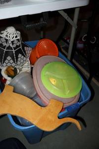 lot 371 image: Misc. Plastic containers plus wood dog silhouette