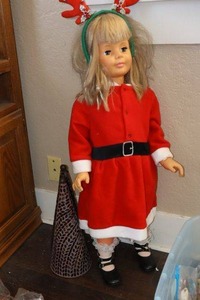 lot 394 image: Standing doll in Santa dress with floor decorations