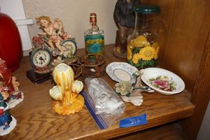 lot 398 image: Home dcor with cherub riding bicycle figurine