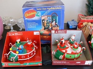 lot 434 image: Christmas spinning teacup carousels and Santa Claus workshop music box telephone