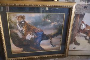lot 542 image: Wall art Leopard in tree print, colorful landscape with waterfall, fox peeking through fence, and Norman Rockwell print