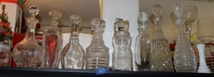 lot 637 image: Clear glass decanters and Mr. Peanut jar