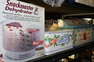 lot 634 image: Kitchen dehydrator, ceramic bread cannister, and painted box