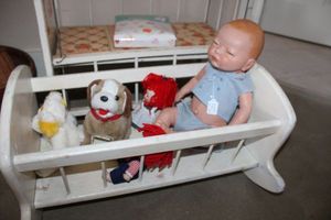 lot 321 image: Ceramic baby doll, doll cribs and toys