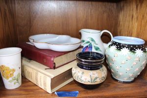 lot 420 image: Vintage Bibles, Fire King white relish dish, vases, and pitcher