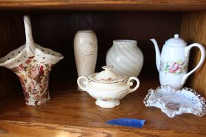 lot 429 image: Ivory and white ceramic basket, vases, and ruffled glass bowl