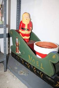 lot 492 image: Wooden Christmas sleigh, vintage plastic Santa, and Santa planters